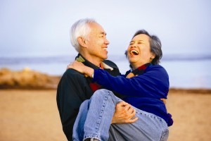 hip-recovery-old-couple-on-beach-at-sunset-300x200